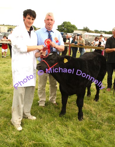 Paul Yorke  Ballymahonn Longford is presented with rosette for Best Male Calf Born 2008 at the Roundfort Agricultural Show by  Owen O'Neill Bova AI Limerick (Judge). Photo Michael Donnelly