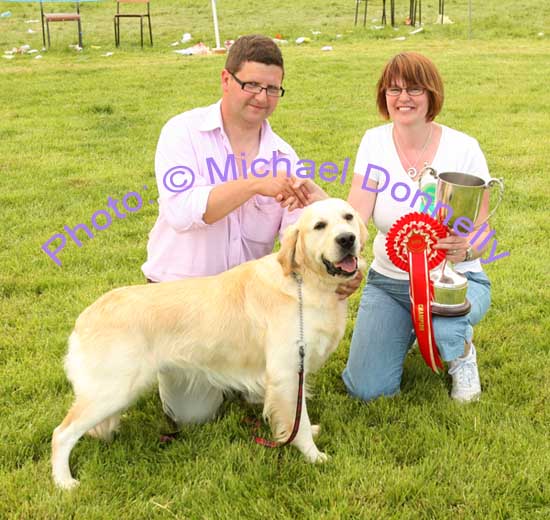 Declan Mangan Cloghans Hill Tuam pictured with his Golden Retriever "Setanta" who won the Champion Dog at Roundfort Agricultural Show is presented with the Thomas Lyons Memorial Cup by Breda O'Malley, Show committee. Photo Michael Donnelly