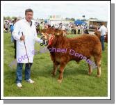 Liam Lavelle Belmullet, pictured with his prizewinning  Young Bull Calf (Limousin) at Roundfort Agricultural Show. Photo Michael Donnelly