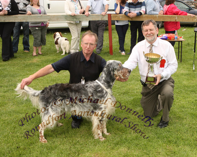 Seamus Fallon, Tuam pictured with his English Setter "Darcy" winner of the Best Pedigree Dog, is presented with the Anne  Fahy Ronayne Cup by Dr Gerard Fleming, Galway (Judge) at Roundfort Agricultural Show.Photo:  Michael Donnelly
