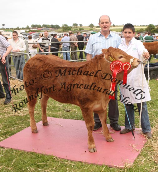 Cathal O'Meara, Ardnacrusha, Co Clare  on right pictured with his champion Interbreed Heifer pictured with Jim Nally, Chairman Roundfort Agricultural Show at Roundfort Agricultural Show. Photo:  Michael Donnelly
