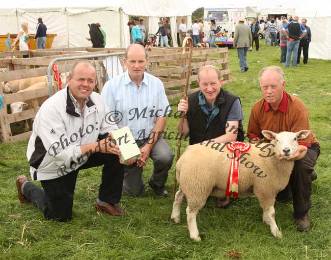 Aidan Fahy, Ardrahan Co Galway on right with his Factory Lamb, Commercial Champion Sheep of Roundfort Agricultural Show, included  in photo from left: PJ Coen, Roundfort Show;Jim Nally Chairman Roundfort Agricultural Show and Eamon Walsh, Ballina (Sheep Judge). Photo:  Michael Donnelly