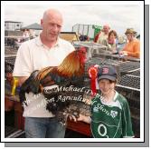 John and John Kenneth Dowling, Crossmolina with their champion Heavy Cock, Soft Feather at Roundfort Agricultural Show, Co Mayo. Photo:  Michael Donnelly