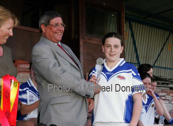 Kathryn Sullivan St Josephs Secondary School Castlebar is presented with the Player of the match award  by Graham Fester, (Depot manager Pat The Baker Kilkenny)  Cumann Peil Gael na mBan Pat the Baker Post Primary Schools All Ireland Senior Final 2007 in Cusack Park Ennis. Photo:  Michael Donnelly