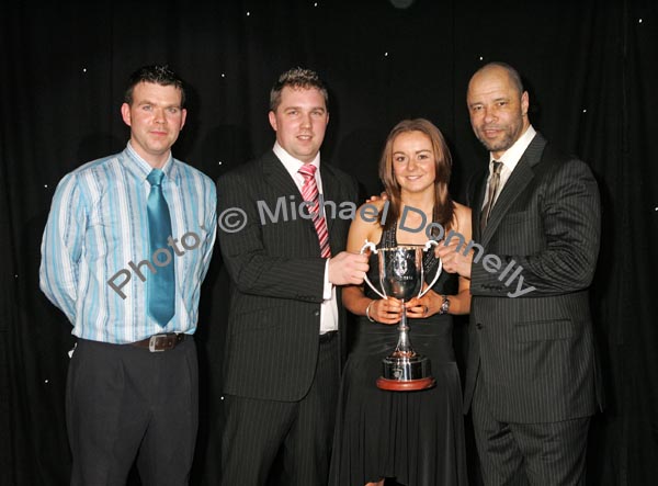 Aoife Herbert winner of the Ivan Neill "Young Sports Star of the Year" award is presented with the cup by Ivan's nephew Reuben and Guest of Honour Paul McGrath at the Western People Mayo Sports Awards 2006 presentation in the TF Royal Theatre Castlebar. Included in photo on left is Anthony Hennigan, Sports Editor of the Western People. Photo:  Michael Donnelly