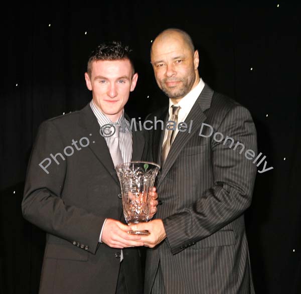 Cathal Freeman, Tooreen and Mayo Hurling star is presented with his trophy by Guest of Honour Paul McGrath at the Western People Mayo Sports Awards 2006 presentation in the TF Royal Theatre Castlebar. Photo:  Michael Donnelly