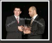 Tom Prendergast accepts the Hall of Fame award on behalf of his uncle Paddy Prendergast from Guest of Honour Paul McGrath at the Western People Mayo Sports Awards 2006 presentation in the TF Royal Theatre Castlebar. Photo:  Michael Donnelly