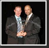 Guest of Honour Paul McGrath presents the Cycling award to Padraig Marrey, Ballinrobe at the Western People Mayo Sports Awards 2006 presentation in the TF Royal Theatre Castlebar. Photo:  Michael Donnelly