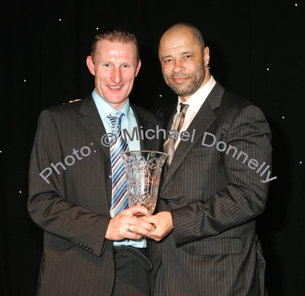 Guest of Honour Paul McGrath presents the Cycling award to Padraig Marrey, Ballinrobe at the Western People Mayo Sports Awards 2006 presentation in the TF Royal Theatre Castlebar. Photo:  Michael Donnelly