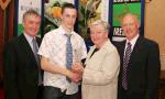 Brian Markham Ennis Track is presented with his award at the Waterford Crystal A.A.I, Juvenile Star Awards in the Belmont Hotel, Knock Co Mayo by  Breda Synott chairperson National Juvenile Committee AAI, included in photo are  Patsy McGonagle Vice-president AAI and Michael Gaffney Waterford Crystal (sponsors), Photo Michael Donnelly

