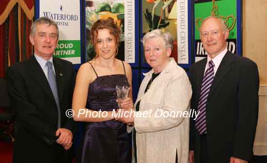 Louise Nicholson Emerald AC Limerick is presented with her award at the Waterford Crystal A.A.I,  Juvenile Star Awards in the Belmont Hotel, Knock Co Mayo by by  Breda Synott chairperson National Juvenile Committee AAI, included in photo are Patsy McGonagle Vice-president AAI and Michael Gaffney Waterford Crystal (sponsors). Photo Michael Donnelly