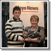 Juvenile Male Cross Country winner Daniel Murray of Ballina AC received his award from Marion Mattimoe PRO Mayo Athletics Board