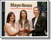Overall Athlete of the year Pamela Hughes of Westport AC is presented with the main award of the night at the Mayo News Mayo Athletic awards by Marie O'Malley Mayo Athletics Board and Denis Horan Editor Mayo News. Photo:  Michael Donnelly