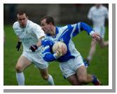 Marty McNicholas Breaffy is closely watched by Ballaghaderreen  defenders in the Breaffy House and Spa  County Intermediate Football Championship Final in McHale Park Castlebar. Photo: Michael Donnelly