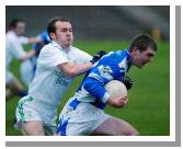 Breaffy is closely watched by Ballaghaderreen  defenders in the Breaffy House and Spa  County Intermediate Football Championship Final in McHale Park Castlebar. Photo: Michael Donnelly
