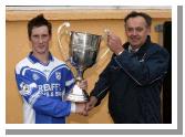 Paddy Naughton chairman Mayo GAA County Board presents the James Sweeney Memorial Cup to Gerry Jennings captain of Breaffy after they defeated Ballaghaderreen l  in the Breaffy House and Spa  County Intermediate  Football Championship Final in McHale Park Castlebar. Photo: Michael Donnelly