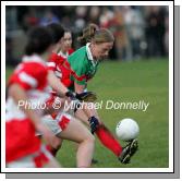 Claire Egan is shadowed by 3 Donaghmoyne players at the Vhi Healthcare All-Ireland Ladies Senior Club Championship Final, Donaghmoyne v Carnacon, Pairc Na nGael, Dromard, Co Longford.  Photo:  Michael Donnelly