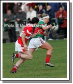 Fiona McHale Carnacon is pursued by Fiona Courtney (capt.) Donaghmoyne (Monaghan) in the VHI Healthcare All Ireland Ladies Club Championship Senior Final 2006 at Dromard Co Longford. Photo:  Michael Donnelly