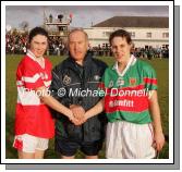 Captains exchange greetings prior to the VHI Healthcare All Ireland Ladies Club Championship Senior Final 2006 at Dromard Co Longford, from left Fiona Courtney, Donaghmoyne (Monaghan); referee Tony Clarke Dublin and Martha Carter Carnacon. Photo:  Michael Donnelly