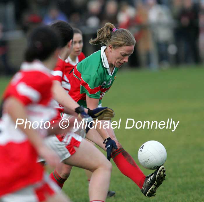 Claire Egan is shadowed by 3 Donaghmoyne players at the Vhi Healthcare All-Ireland Ladies Senior Club Championship Final, Donaghmoyne v Carnacon, Pairc Na nGael, Dromard, Co Longford.  Photo:  Michael Donnelly
