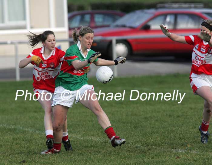 Cora Staunton, Carnacon is closely marked by plaayers from Donaghmoyne (Monaghan) in the VHI Healthcare All Ireland Ladies Club Championship Senior Final 2006 at Dromard Co Longford. Photo:  Michael Donnelly