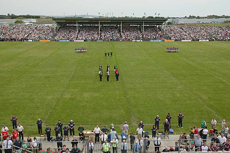 Observing a minute's silence in memory of Joe Langan before the Bank of Ireland Connacht Senior Football Championship in McHale Park Castlebar