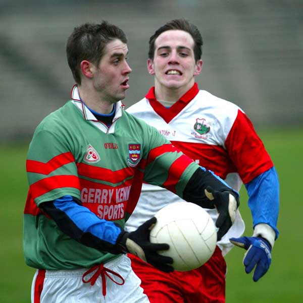 Ballina Stephenites Corner back Michael McHale is closed watched by Aughamore's Kevin Nolan in the Breaffy House and Spa  County Junior Football Championship Final in McHale Park Castlebar. Photo: Michael Donnelly