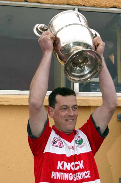 Liam  Walsh captain Aughamore lifts the Pete McDonnell Memorial Cup after they defeated Ballina Stephenites B in the Breaffy House and Spa  County Junior Football Final in McHale Park Castlebar. Photo: Michael Donnelly