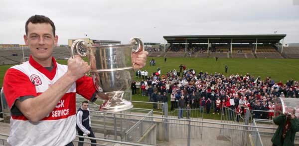 Liam Walsh captain Aughamore with the Pete McDonnell Memorial Cup and supporters after they defeated Ballina Stephenites B in the Breaffy House and Spa  County Junior  Football Final in McHale Park Castlebar. Photo: Michael Donnelly