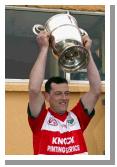 Liam  Walsh captain Aughamore lifts the Pete McDonnell Memorial Cup after they defeated Ballina Stephenites B in the Breaffy House and Spa  County Junior Football Final in McHale Park Castlebar. Photo: Michael Donnelly