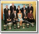 Shona Hegarty (front centre) representing Darragh Quinn Chemists, Crossmolina sponsors of the service awards which were presented to Crossmolina players who had played in 50 or more Championship matches for Crossmolina, at the Club's Dinner Dance in the Upper Deck Crossmolina, from left:  Liam Moffatt, Joe Keane, Peadar Gardiner and Noel Convey; At back; Deputy John Carty, T.D.; Cathal Prior, Club Chairman; Ann Heffernan, Club Lady of the Year; Billy Fitzpatrick, Special Guest (Mid West Radio), and James Waldron, Chairman Mayo GAA County Board. Photo:  Michael Donnelly