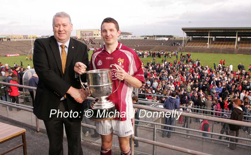 James Waldron, Chairman Mayo GAA County Board presents the Moclair Cup to Peadar Gardiner, captain of Crossmolina Deel Rovers after they defeated Ballaghaderreen in the Lynch Breaffy House Hotel and Spa County Senior Football final replay in McHale Park, Castlebar. Photo:  Michael Donnelly