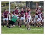 Crossmolina defenders see this ball heading to the back of their net in the Lynch Breaffy House Hotel and Spa County Senior Football Final Replay in McHale Park Castlebar. Photo:  Michael Donnelly