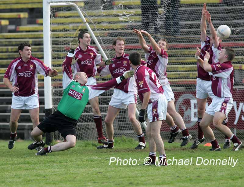 Crossmolina defenders see this ball heading to the back of their net in the Lynch Breaffy House Hotel and Spa County Senior Football Final Replay in McHale Park Castlebar. Photo:  Michael Donnelly