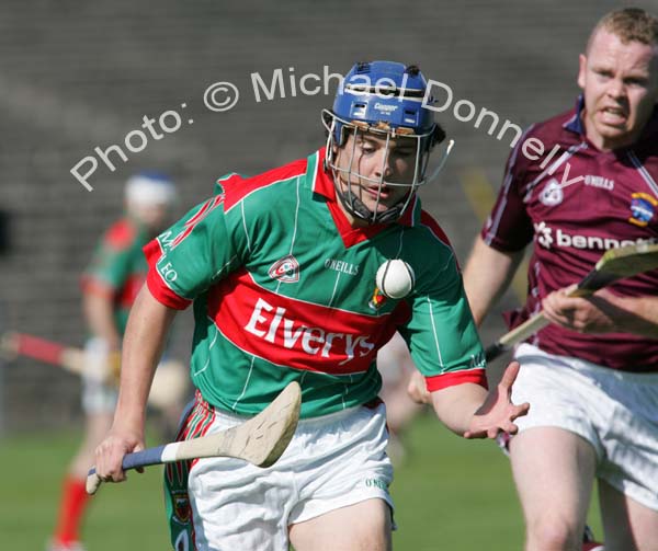 Mayo's Stephen Coyne flips the sliothar as he is pursued by Westmeath's Enda Loughlin in the Christy Ring Cup McHale Park, Castlebar. Photo:  Michael Donnelly