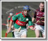 Mayo's Stephen Coyne flips the sliothar as he is pursued by Westmeath's Enda Loughlin in the Christy Ring Cup McHale Park, Castlebar. Photo:  Michael Donnelly