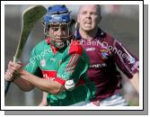 Stephen Coyne about to strike as he is pursued by Westmeath's Enda Loughlin in the Christy Ring Cup McHale Park, Castlebar. Photo:  Michael Donnelly