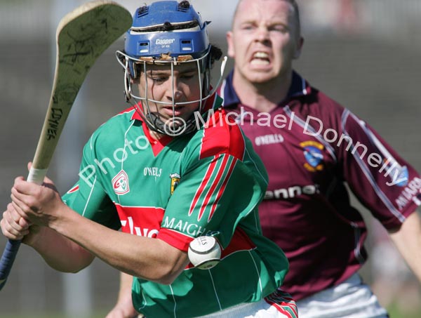 Stephen Coyne about to strike as he is pursued by Westmeath's Enda Loughlin in the Christy Ring Cup McHale Park, Castlebar. Photo:  Michael Donnelly