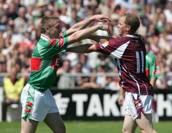 David Heaney and Michael Donnellan engage in a bit of pushing at the Connacht Football Championship Final in Pearse Stadium. Photo Michael Donnelly