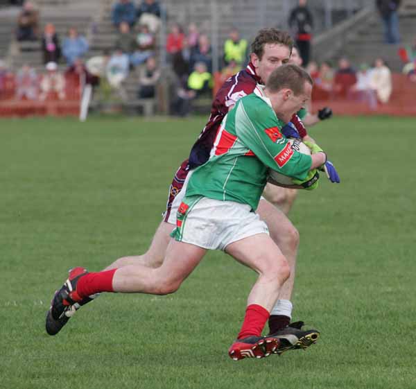 Andy Moran goes stride for stride  at McHale Park at Allianz National Football League Div 1A Round 7 featuring Westmeath v Mayo. Photo Michael Donnelly