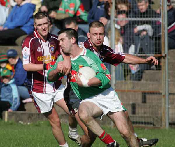 Alan Roche has close company at McHale Park at Allianz National Football League Div 1A Round 7 featuring Westmeath v Mayo. Photo Michael Donnelly