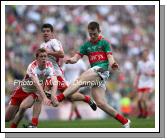 Mayo captain Shane Nally gets his shot in against Tyrone's  Gavin Teague in the ESB GAA All Ireland Minor Football Final in Croke Park. Photo:  Michael Donnelly