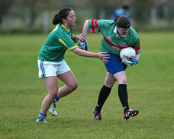 Andrea Keane Claremorris tries to stop Kilmoremoys full forward from launching an attack Photo Michael Donnelly 