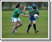 Andrea Keane Claremorris tries to stop Kilmoremoys full forward from launching an attack Photo Michael Donnelly 