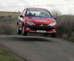 Laura Keenan taking a short flight in a Peugeot 206  in class 6 on stage 1 of the TF Royal Hotel and Theatre Mayo Stages Rally 2005. Photo Michael Donnelly
 