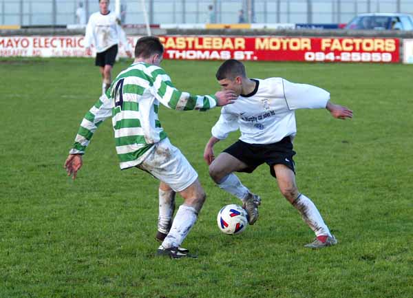 Mark Fitzgerald Tramore tries to get past Castlebar Celtic's Niall O'Hara in the SFAI U-17 at Celtic Park Castlebar. Photo Michael Donnelly 