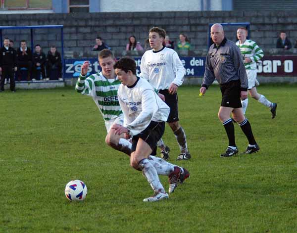 Sean Browne Tramore tries to get past Rory Irwin Castlebar Celtic in the SFAI U-17 at Celtic Park Castlebar. In background is Peter Higgins Tramore. Photo Michael Donnelly