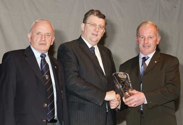 Pat Jennings TF Royal Hotel and Theatre (sponsor at the Connacht Sportswriters Presentation Dinner in the TF Royal Hotel and Theatre Castlebar presents the March award to Michael Meehan (Snr) on behalf on Michael Meehan at the Connacht Sportswriters Presentation Dinner in the TF Royal Hotel and Theatre Castlebar, included in photo on left is Tommy Moran President GAA Connacht Council. Photo Michael Donnelly 