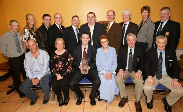 Enda Devenney Ballina pictured with his Connacht GAA Sportswriters Personality of the Month Award for December at the Gala Presentation Dinner in the TF Royal Hotel and Theatre Castlebar, front from left James Devenney, Sheila Devenney, Enda Devenney, Evelyn Devenney, Padraig Prendergast and Jim McGarry.  At back: Barry Murphy, Mairead Kelly, Darragh Clarke, Liam Devenney, Michael Cunningham, Michael Carr, Tommy Lyons, Paddy Ruane,
Maureen Hopkins and Gerry Leonard. Photo Michael Donnelly 
