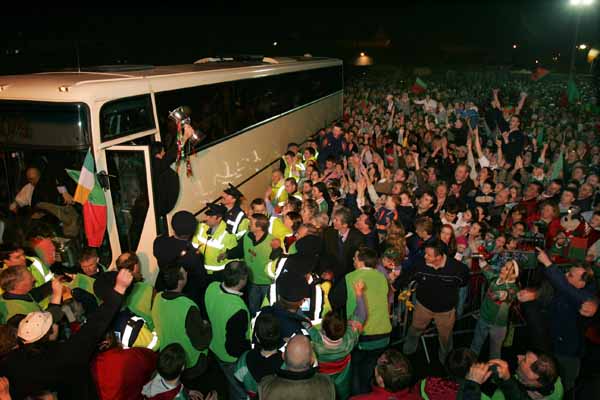 Brian Ruane, captain of the Ballina Stephenites team, displays the Cup to the crowd as he and the team alight from coach at the Homecoming celebrations in James Stephens Park, Ballina. Photo Michael Donnelly